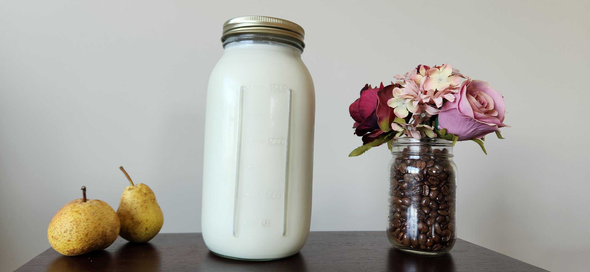 raw goat milk in a glass mason jar